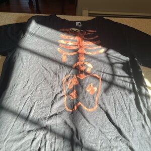Black T-Shirt with Orange Skeleton Design
